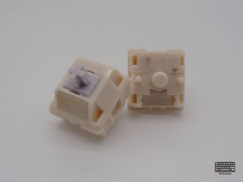 2 HMX Taro Silent, stem malva, top con difusor y bottom crema. Vista frontal y 5 pines.