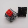 Macro 2 switches Kailh Box V2, stem rojo, top transparente, vista frontal y pines de conexión.