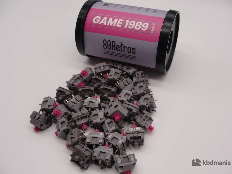 Pack switches HMX Game 1989, lineales, stem fuccia, top y bottom gris oscuro.